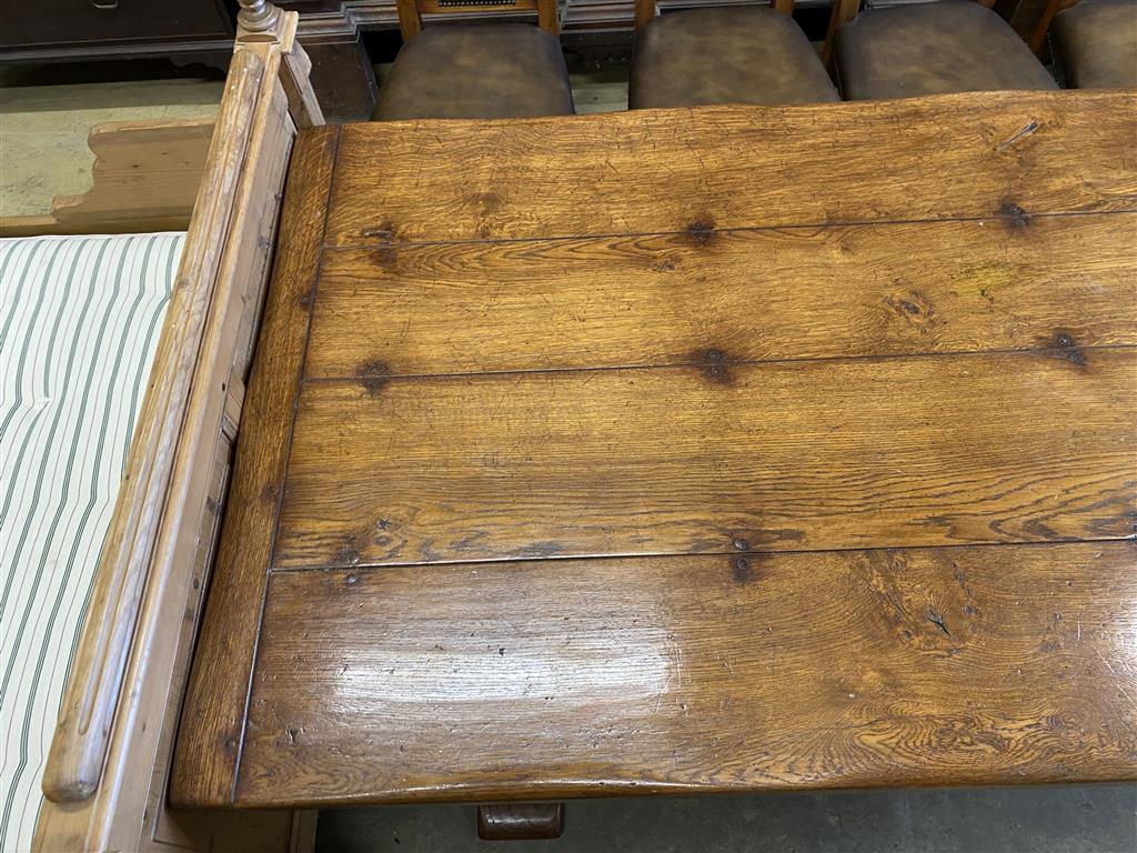 An 18th century style rectangular oak refectory dining table, length 274cm, depth 106cm, height 76cm